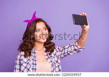 Lovely cute sweet gorgeous nice lady with her brunette hairstyle she isolated on shine violet background in checkered shirt casual wear take selfie picture make beaming toothy smile