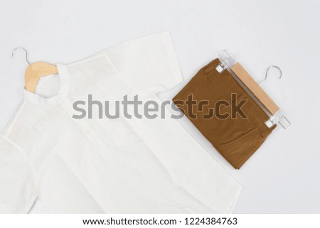 sale, shopping, fashion, style and people concept - Shirt linen concept Navy Green White with chino shorts brown navy concept on white background. Flat lay, Top view.
