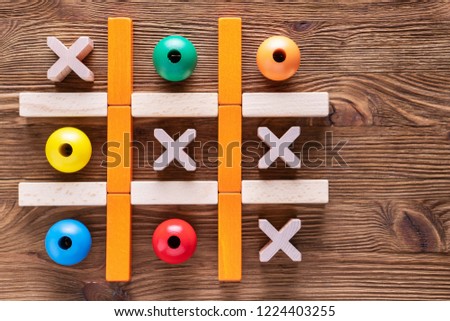 Wooden  tic tac toe (OX) game., The concept of strategy, risk, competition in business.