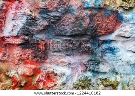 Old abstract red blue multi coloured painted brick wall background