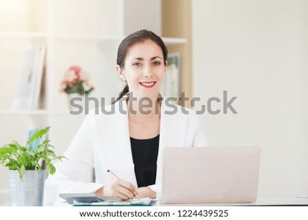 Portrait business women smiling working in office