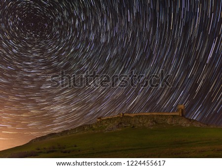 Star trails over the Enisala fortress in Dobrogea, Romania