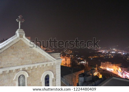 Catholic Church on the background of the night city lights