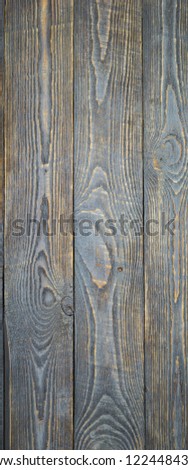 Background of natural wooden textured boards with traces of gray paint. Vignetting