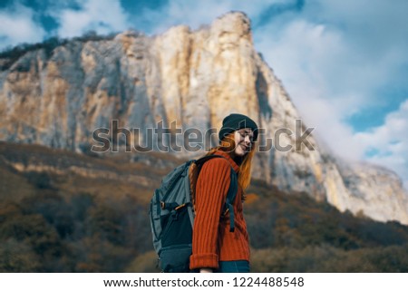 woman tourist on a mountain background                    
