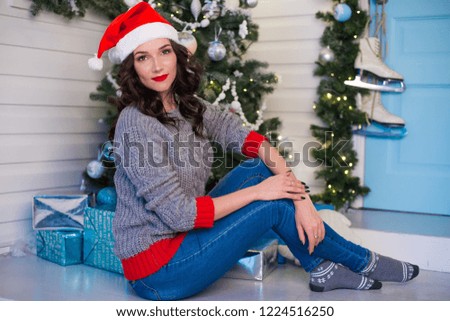 An attractive young woman is celebrating Christmas.