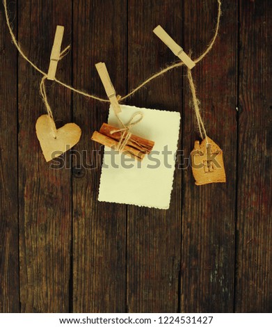 

christmas  background with clean sheet ,gingerbread,hanging on wooden background/ Christmas handmade garland
