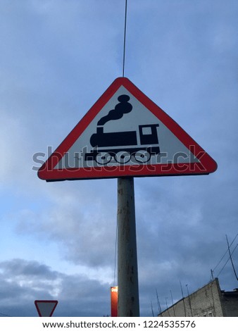 Road sign "railway crossing". Road sign with a picture of a locomotive, train