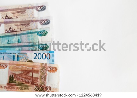 copy space with 500, 1000, 2000, 5000 Russian rubles banknotes on a white background