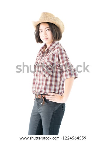 Young pretty woman in a cowboy hat and plaid shirt with isolated on white background