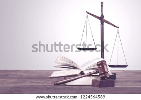 scales of justice on law books in a courtroom or law firm. concept of law,legal education.