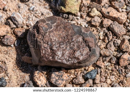 Atacama Desert is maybe the best place in the world to found meteorites on the ground. Going with a meteorite hunter deserves this, a tektite black meteorite coming from the outer space to the desert