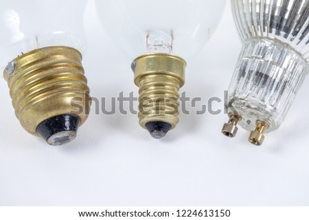 Three different types of light sources / lamp sockets. E27, E14 and GU10. Royalty-Free Stock Photo #1224613150