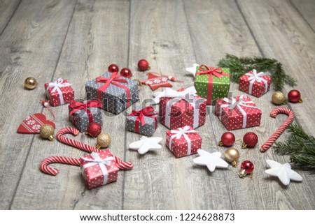  beautiful set of Christmas accessories - Christmas tree branches, gifts, decorations on the wooden floor