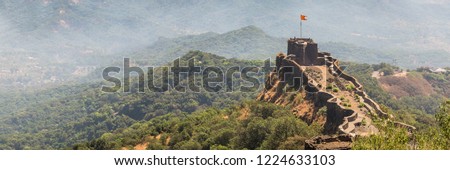 Pratapgad Fort, Mahabaleshwar, Maharashtra, India - Feb 23 2017 : Panoramic of fort with the deccan hills beyond Royalty-Free Stock Photo #1224633103