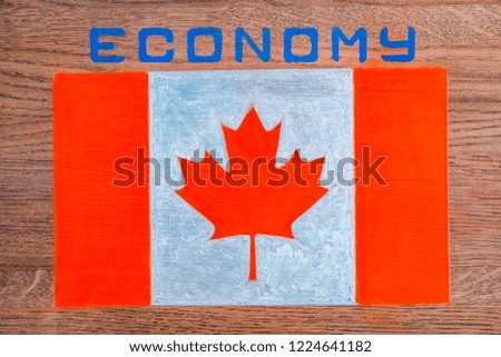 Flag of Canada. Above the image of the flag inscription economy.