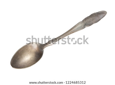 Top view of old silver beautiful tea spoon isolated on white background