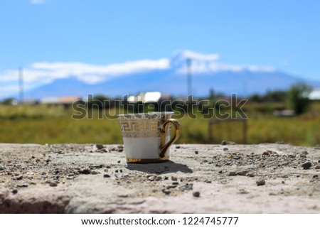 old building, coffee and mountain view
