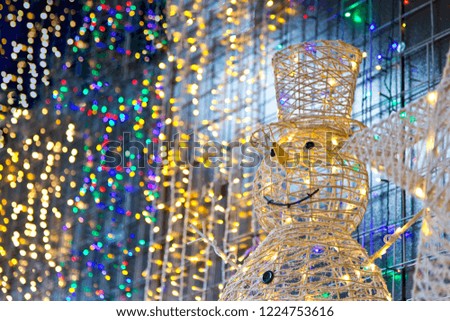 Snowman in colorful lights