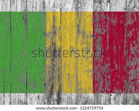 Mali flag painted on old wood plank background