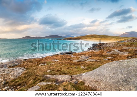 The Isle of Harris coastline looking out to Traigh Lar beach with the Isle of Taransay in the far distance