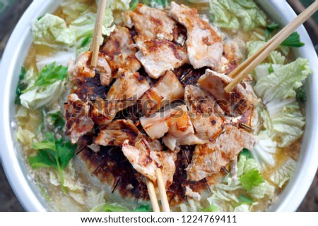 Thai barbecue Grill Pork on hot pan buffet, Moo-gata Pork pan It's traditional Thai style BBQ, barbecue buffet pig pan and vegetables in soup, Cooking barbecue pork Fatty foods, Moo Kra Ta (thai word) Royalty-Free Stock Photo #1224769411