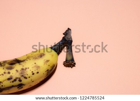 Single overripe banana isolated over white background