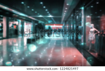 Blurred panorama of the shopping center with a number of shops, shop Windows, mannequins. Background image.