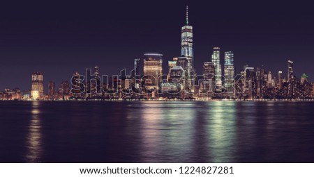 New York City panorama at night, color toned picture, USA.