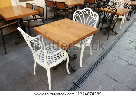 Cafe table and chairs.Street cafe tables and chairs.Black and White chairs                            