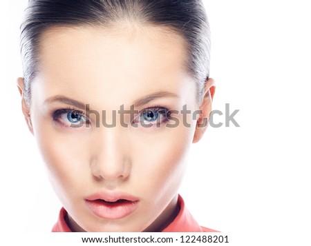 Beauty.Perfect female close-up portrait . Make up. White.Background Blue eyes. Full lips.Space .Foundation.Face.Eyebrows.Sunscreen.Perfect skin.Beauty salon.