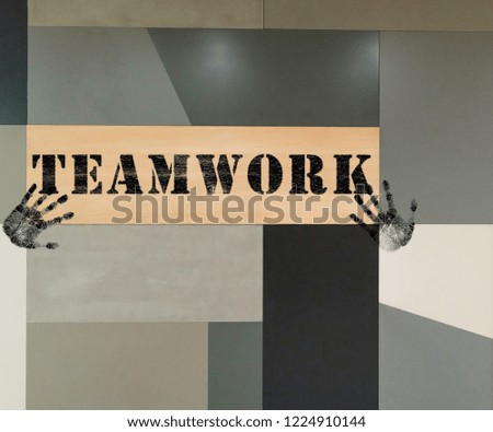 different type of board formed background with text teamwork painted