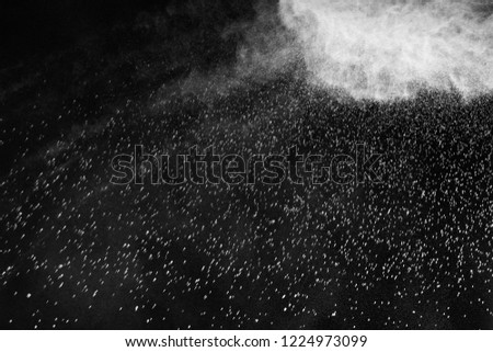  White powder explosion isolated on black background
