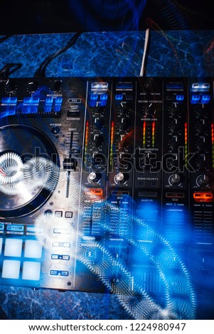 DJ mixer controller panel for electronic music in night club