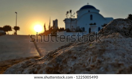 A wonderful picture captured during morning walk with a beautiful sunrise lighting a church near the sea in Pafos Cyprus