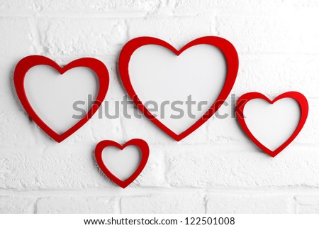 heart picture frame on white wall,valentine concept.