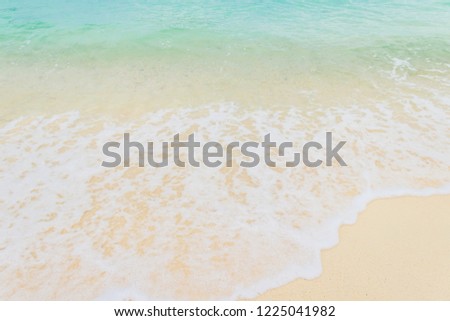 Beach Shore sand sea and white foamy blue wave on day light,Shore background well use editing for present or text on your projects