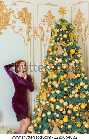 Winter holiday concept. Inspiration and fairy time. Girl near christmas tree at holydays. Pretty nice lady in velvet dress, holiday days, magical christmas time