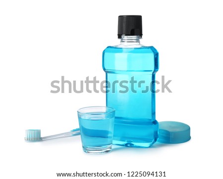 Mouthwash and other items for teeth care on white background Royalty-Free Stock Photo #1225094131