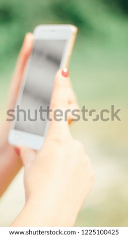 Woman with mobile phone, outdoors. Banner