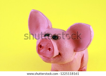 2019 new year of pig by Chinese horoscope, piglet toy symbol. Yellow background. Cute pink piggy.