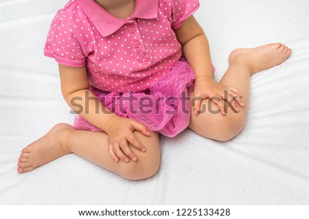 Child sitting in bad position, which is called W-sitting. W-sitting can cause to hip dislocation. Royalty-Free Stock Photo #1225133428