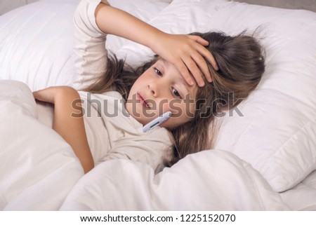 Cold girl lying in bed