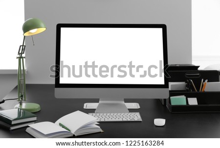 Workplace with computer on table in office