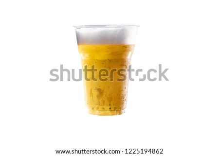 Close up of the beer in plastic glass on white background.