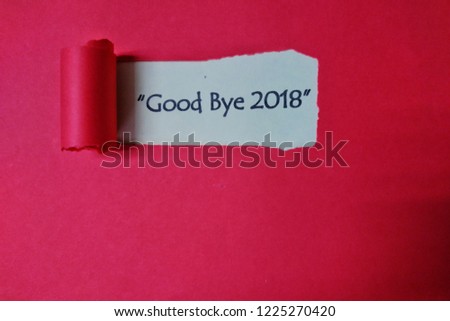The text good bye 2018 word appearing behind torn paper.