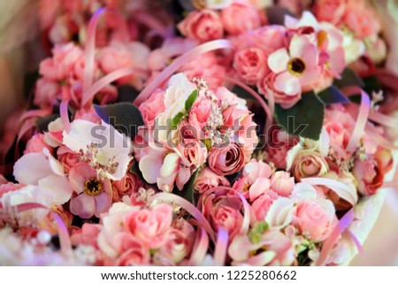 Elegant gifts of flowers for guests at a wedding or other celebration, decorated with ribbons.