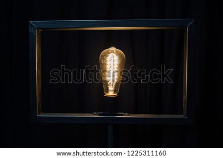 Decorative lamp in a pentagonal frame