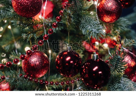Christmas tree with red toys and decorations and lights