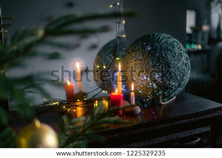 candles burning in the Christmas night, cozy home photo